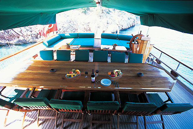 social meeting point, the dinner table on the aft deck - M/S ANGEL